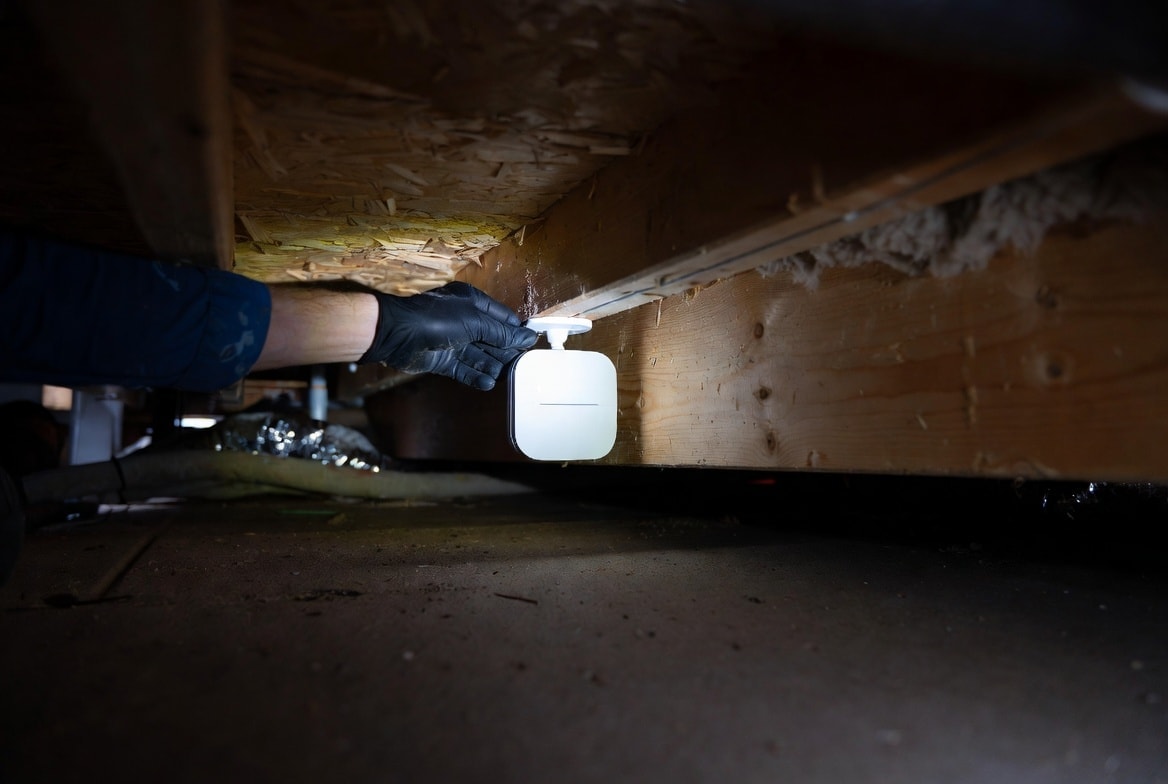 IoT monitoring sensor installed on pipe